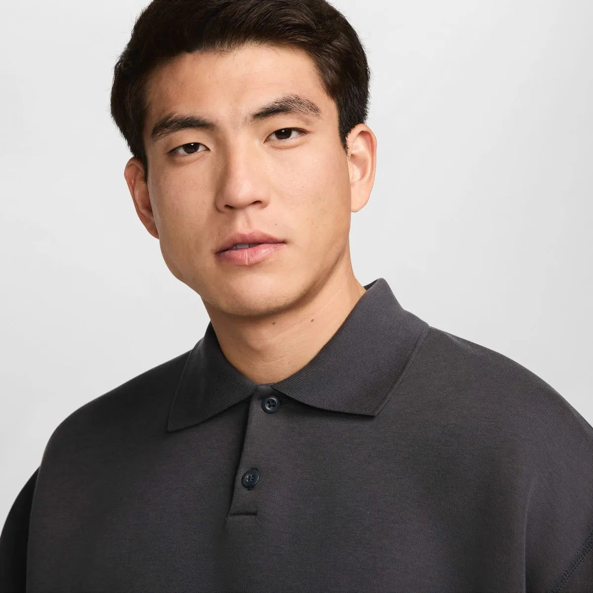 NIKE Tech FLC Polo Oversized in Black