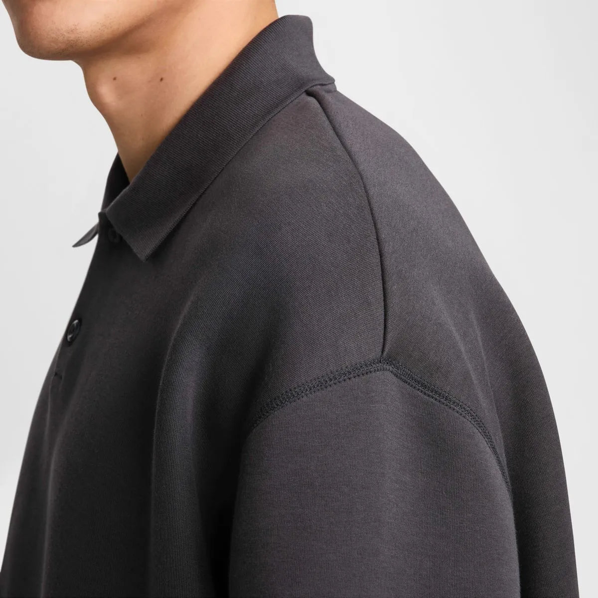 NIKE Tech FLC Polo Oversized in Black