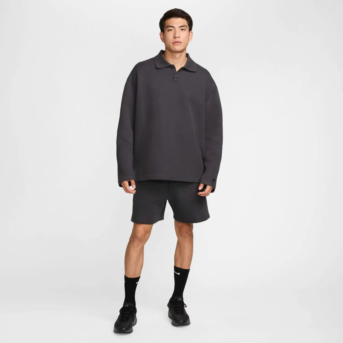 NIKE Tech FLC Polo Oversized in Black