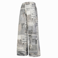 Loose-fitting jeans with newspaper and graffiti print