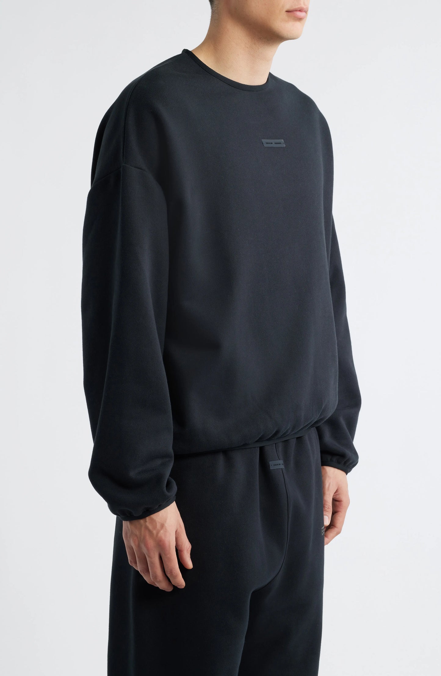 Fear of God Essentials Fleece Crewneck in Black