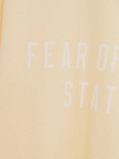 FEAR OF GOD ESSENTIALS  playera con logo estampado (OVERSIZED)