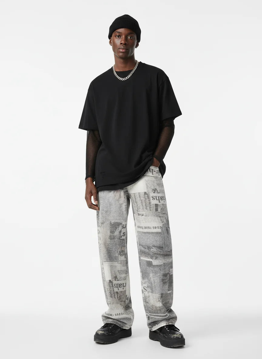 Loose-fitting jeans with newspaper and graffiti print