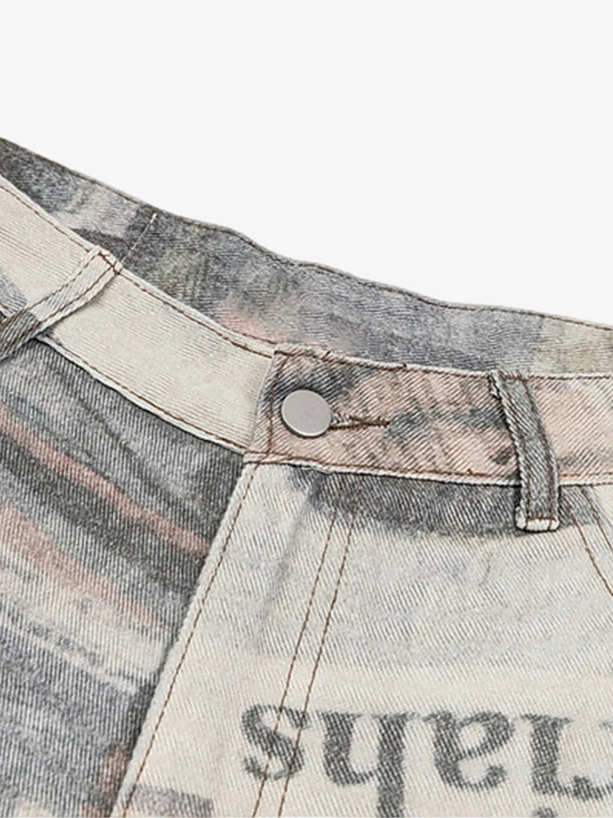 Loose-fitting jeans with newspaper and graffiti print